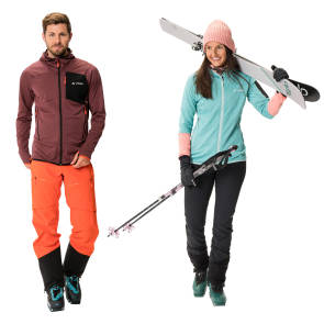 Mann und Frau mit Wintersportausrüstung und Ski