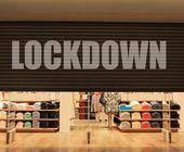 Ladenrollladen mit der Beschriftung Lockdown