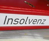 roter Ordner mit Aufschrift Insolvenz